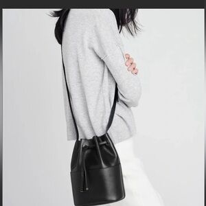 Cuyana black crossbody preloved , some wear to handle of strap